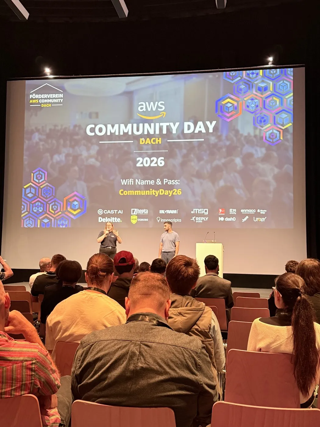 Opening session of AWS Community Day DACH 2026 on stage in Berlin in front of a full auditorium