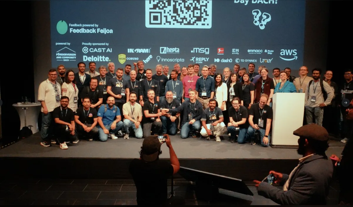 Group photo of AWS Heroes, Community Builders, and speakers on stage at AWS Community Day DACH 2026 in Berlin