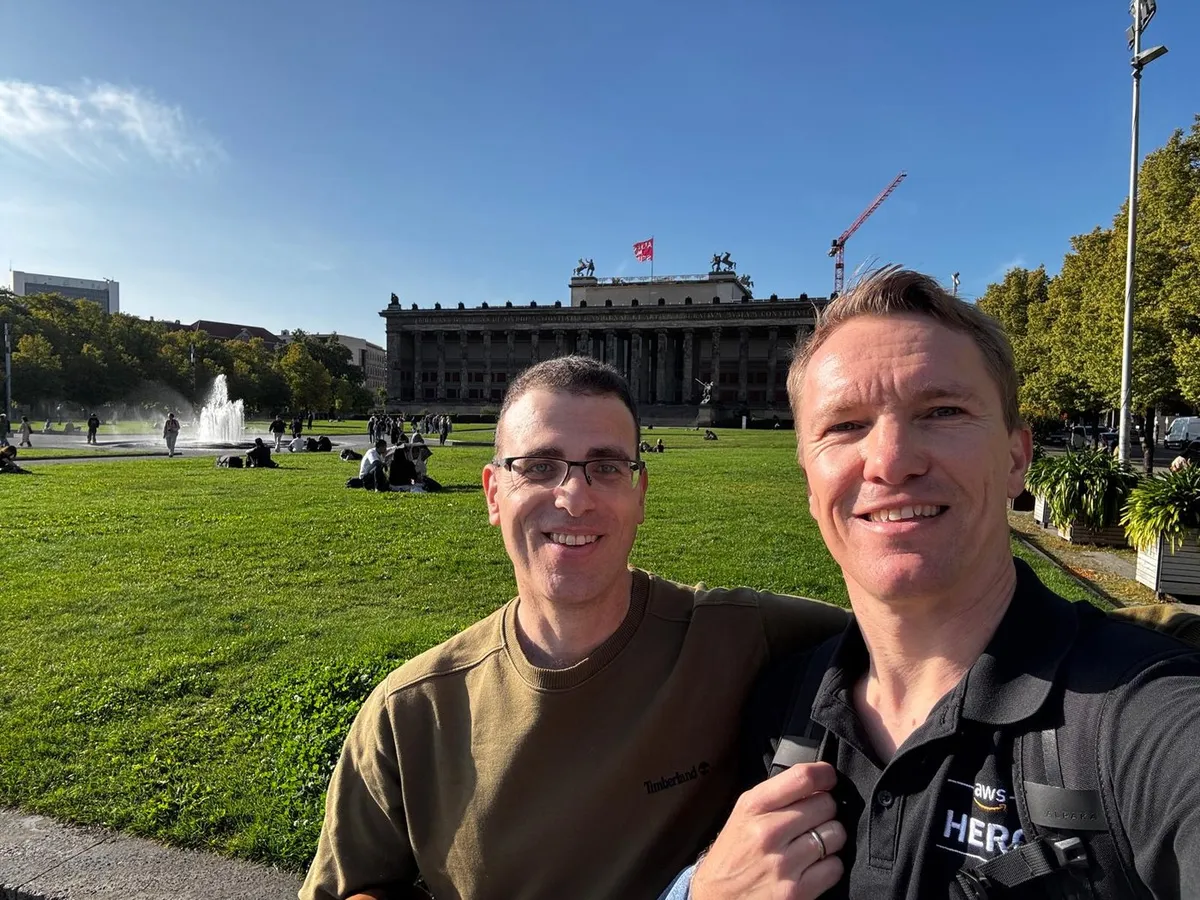Ran Isenberg and AWS Hero Johannes Koch taking a selfie in a Berlin park near the Altes Museum